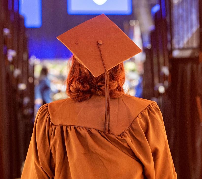 A Pitt graduate walks into the commencement ceremony held at the Petersen Events Center.